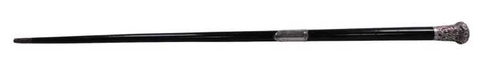 A Victorian ebony and silver mounted conductor's baton, the grip embossed with flowers and...