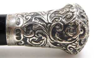 A Victorian ebony and silver mounted conductor's baton, the grip embossed with flowers and... - 3
