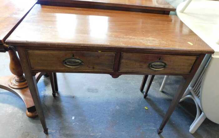 A 19thC mahogany side table, the top with a moulded edge above two frieze drawers, raised on...