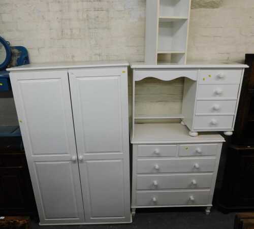 A group of white painted bedroom furniture, comprising a double wardrobe, chest of two short...