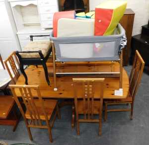 V - A pine dining table together with six chairs, an ebonised piano stool, baby bassinet, etc. (a...