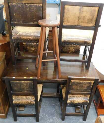 An oak drawer leaf table, raised on a part carved trestle type base, 76cm high, the top 126cm x...
