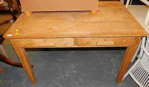 An oak table, the rectangular top above two frieze drawers, raised on square tapering legs, 78cm...
