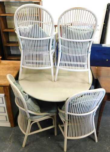 A pale green painted drop leaf conservatory table, together with four chairs. 
The upholstery in...