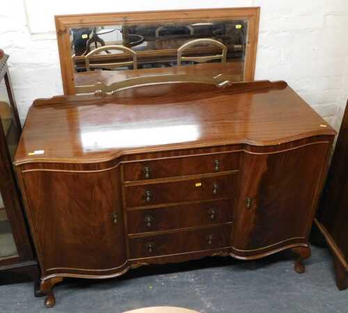 A mahogany inverted breakfront sideboard, together with a pine framed mirror. (2)