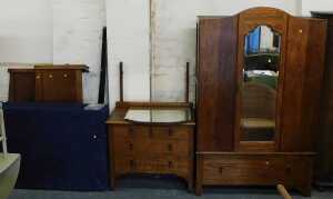 An early 20thC oak bedroom suite, comprising wardrobe, mirror back dressing table, and bed frame,...