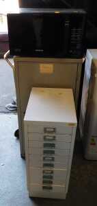 V - A Ryman Conran multi-drawer cabinet, together with a further metal cabinet, a two tier trolley,...