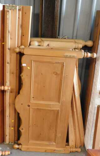 A pine double bed frame, with slats and side rails, and another.