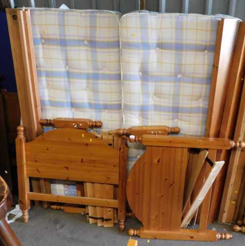 Two pine bed frames, together with slats, side rails, and mattresses.