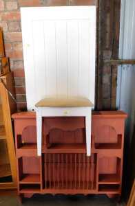 A red painted wall hanging plate rack, 99cm high, 100cm wide, 20cm deep, together with a stool,...