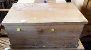 A waxed pine chest, the hinged lid enclosing a vacant interior, raised on a plinth base, 30cm...