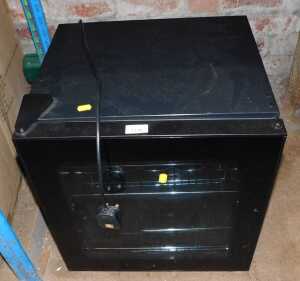 A black drinks fridge, 47cm high.