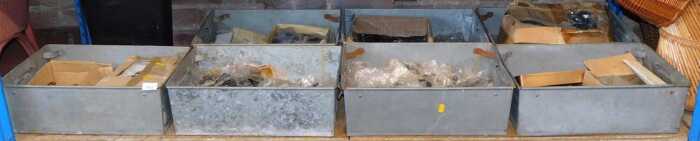 Various galvanised metal containers, containing door furniture, to include handles, door knobs,...