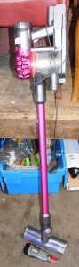A Dyson motor head portable vacuum cleaner.