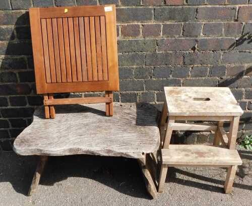 A teak folding garden table, a wooden two step ladder, together with a wooden table.