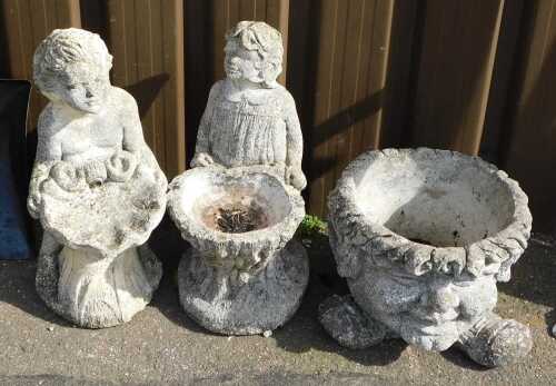 Two concrete garden figures, together with a plant pot.