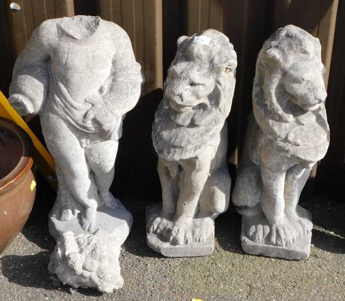 A pair of reconstituted stone lion garden ornaments, 55cm high.