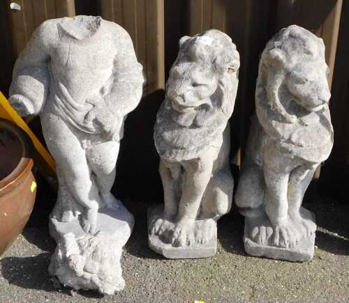 A pair of reconstituted stone lion garden ornaments, 55cm high.
