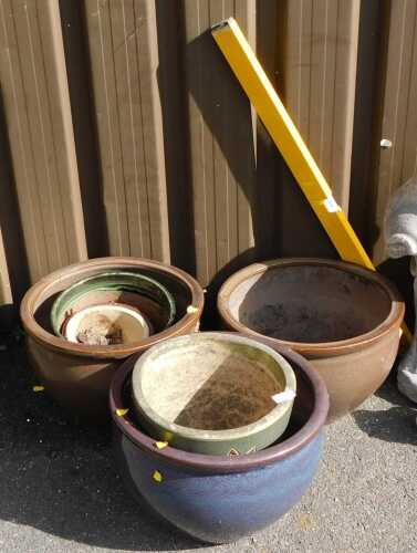 Garden pots, together with a statue, (AF), and a spirit level.