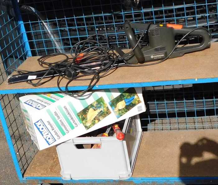 A Gardena EHT410 electric hedge trimmer, together with a garden kneeler and other tools.