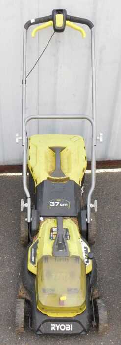 A Ryobi battery operated lawn mower.