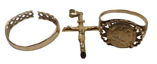 A crucifix pendant, yellow metal, stamped 9kt, a 9ct gold Claddagh band, cut, and a 9ct gold and...