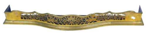 A Victorian brass fender, with pierced decoration, 122cm wide, 21cm deep.
