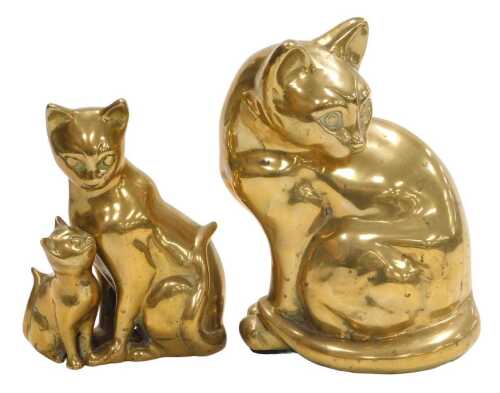 A heavy brass figure of a seated Siamese cat, 21cm high, and a further brass figure group of a...