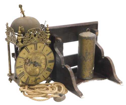 An 18thC brass lantern clock, the circular dial with engraved foliate decoration, chapter ring...