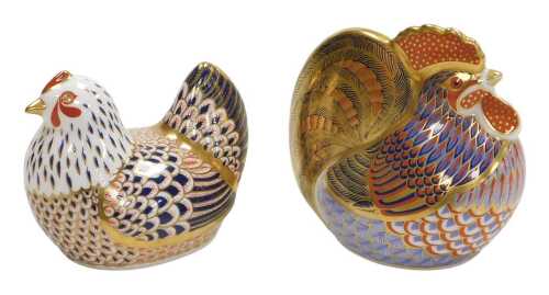 Two Royal Crown Derby porcelain Imari paperweights, modelled as a cockerel, and a chicken, gold...