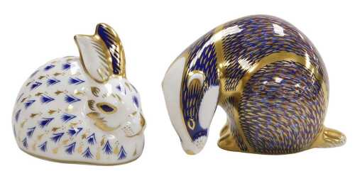 Two Royal Crown Derby porcelain Imari paperweights, modelled as a badger, and a rabbit, gold...
