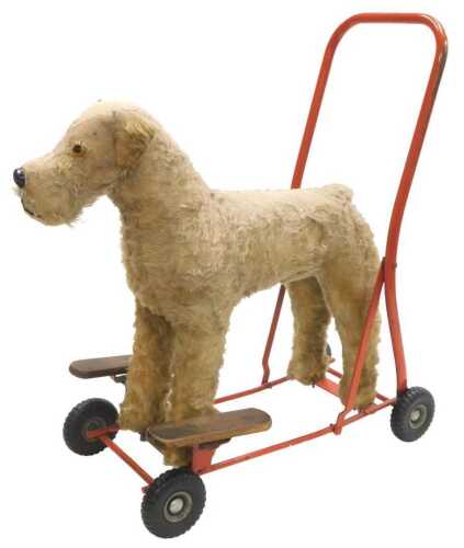 A Tri-ang Pedigree Terrier push along toy, 54cm wide.