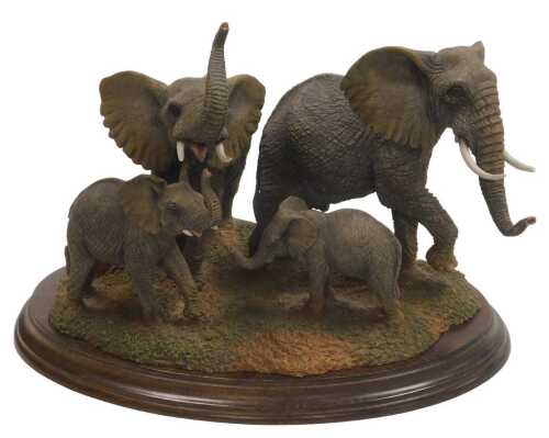 A Country Artists Voice of Africa figure group, modelled with elephants, raised on an oval base....