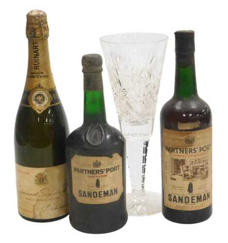 A bottle of Ruinart Pere & Fils champagne, a bottle of Sandeman Partner's Finest Rich Ruby port,...