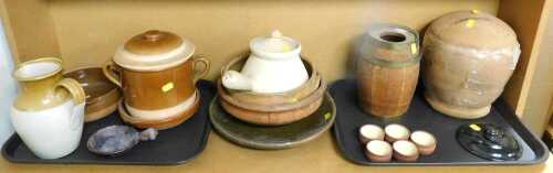 Earthenware and stoneware, comprising part glazed terracotta shallow bowls, a stoneware jug, a...