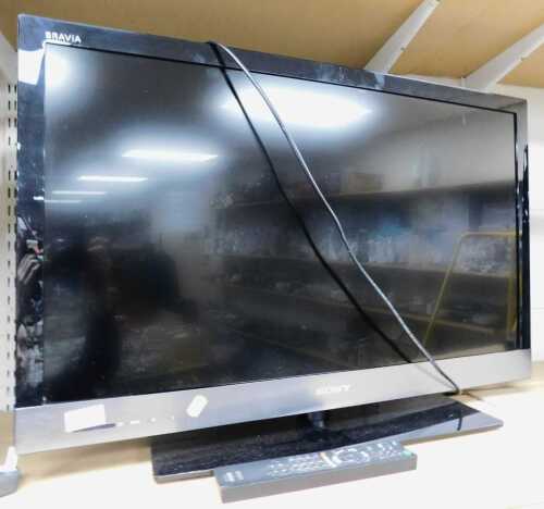 A Sony Bravia 32" television, model number KDL-32EX523, with lead and remote.