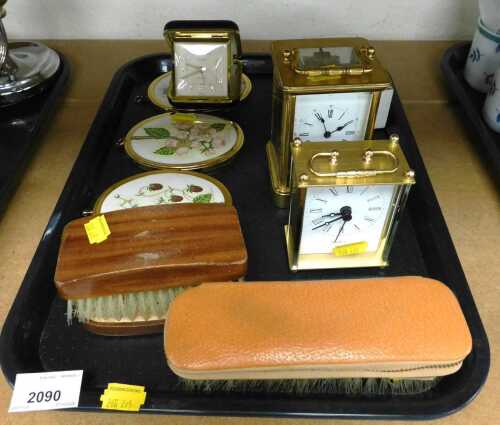 A 20thC brass cased carriage clock, the rectangular white enamel dial bearing Roman and Arabic...