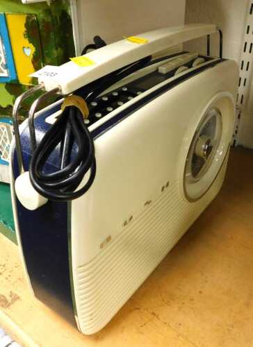 A Bush cream and blue two tone radio.