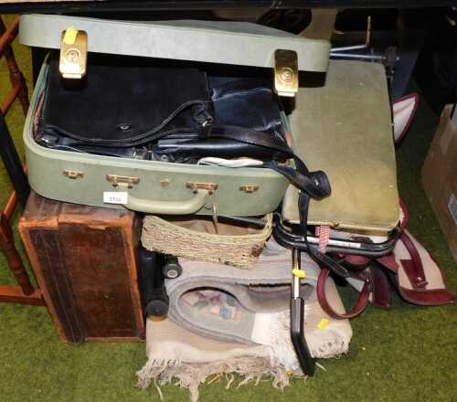 Suitcases, together with a The Bridge black leather shoulder bag, a Chinese wool cut rug,...