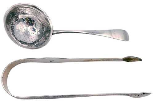 A pair of Georgian silver sugar tongs, with acorn terminals, and bright cut engraving, oval...