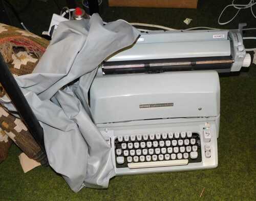 V - A Hermes Ambassador BC-1 typewriter, with cover. Note: VAT is payable on the hammer price of...