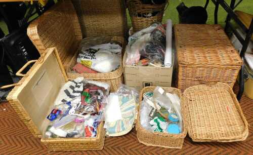 A quantity of wicker hampers, together with sewing materials and equipment, a 20thC postcard...