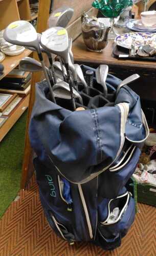 A Ping Golf bag, to include a Meridian sand wedge, Confidence pitching wedge, Confidence and...