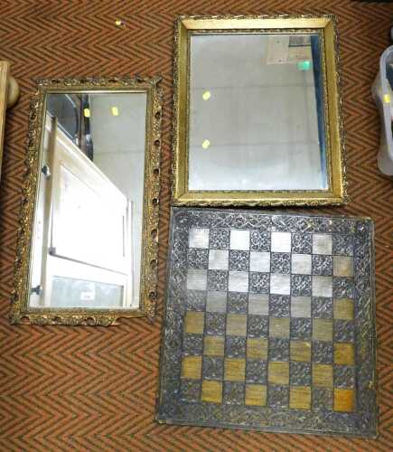A pair of giltwood framed mirrors, with floral and leaf borders, the larger being 64cm high,...