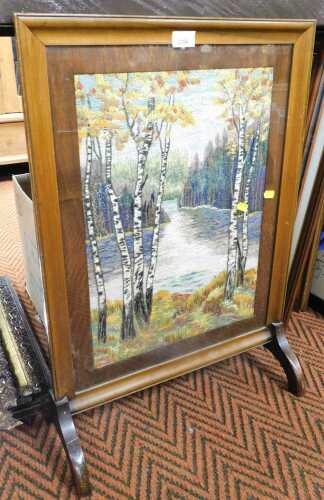 An embroidered firescreen, the embroidery depicting silver birch trees against a backdrop of a...