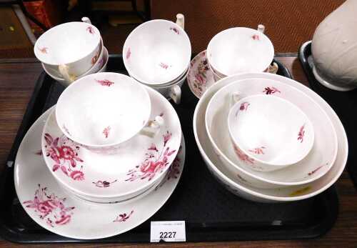 A Victorian porcelain part tea service, decorated in puce with flowers and other similar china.