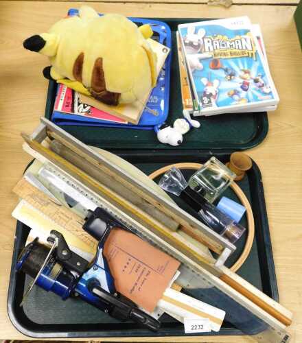 A Pokemon Pikachu toy, Wii games, rulers, etc. (2 trays)