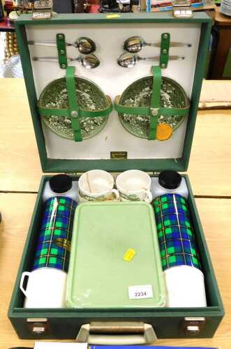 A Brexton picnic set, with tartan thermos flasks, green printed teaware, teacups and saucers, (1...