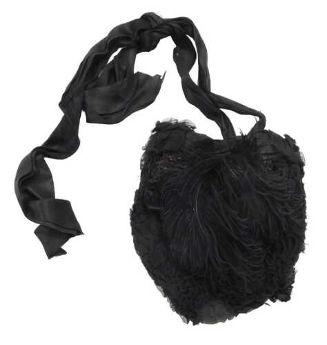 A Victorian lady's black silk and feather bonnet.
