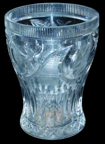 An early 20thC heavy cut glass vase, with engraved foliate decoration, 24cm high.